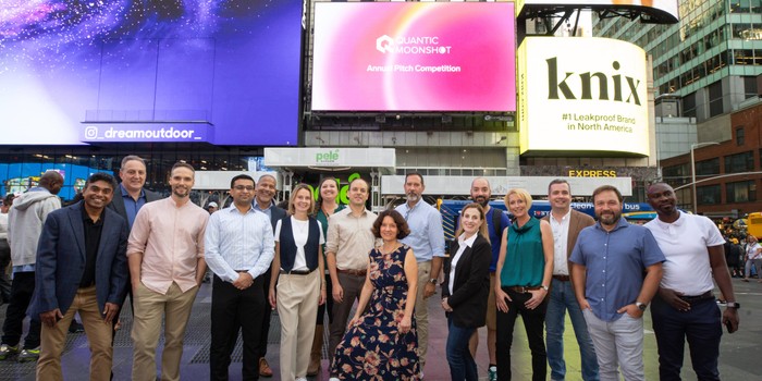 Finalists strike a pose in front of their Times Square billboard