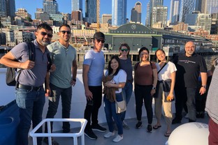 Students snap a pic in front of the Seattle Aquarium during a Quantic Conference.