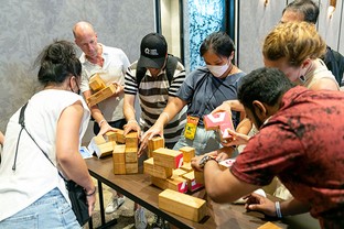 Students compete to solve a block puzzle at a recent event