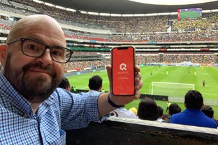 A student brings out the Quantic App during a Mexico City Soccer Game.