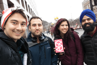 Students pose with the Quantic app at a meetup in Montreal