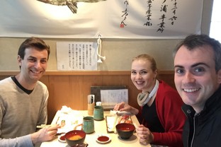 Students enjoy dinner together during a Tokyo event.